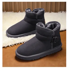 Detail of grey children's snow boots showing thick warm fur lining and side buckle