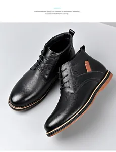 Close-up of black pebbled leather men's chukka boots with elegant brown sole detail