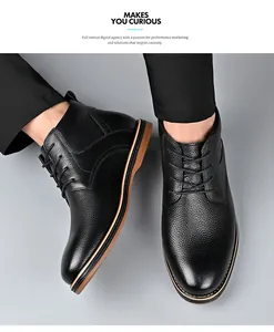 Close-up view of black leather Martin boots with textured finish and lace-up design.