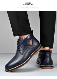 Close-up detail of navy blue leather Martin boots for men with stylish lace-up design.