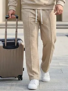 Men's loose waffle knit casual trousers with elastic drawstring waist for outdoor wear