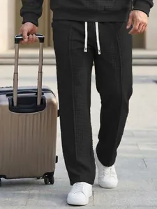 Men's loose waffle knit leisure pants with drawstring elastic waist for outdoor wear