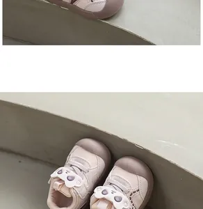 Close-up of cute panda cartoon strap on pink breathable toddler walking shoes