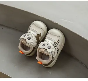 Close-up view of breathable infant toddler shoes with cute cartoon panda face design