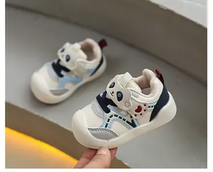 Detail of toddler soft-sole walking shoes with cute panda cartoon design for infants