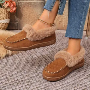Close-up of cozy brown suede slippers with fluffy faux fur lining and trim