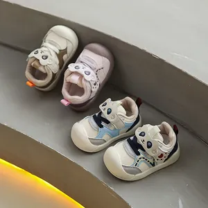 Detail view of multi-color infant toddler shoes with cute panda cartoon velcro straps.