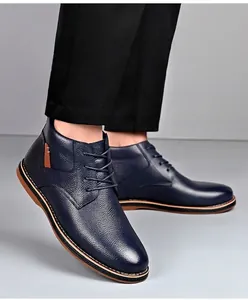 Navy blue textured leather boots for men with lace-up design in autumn style.
