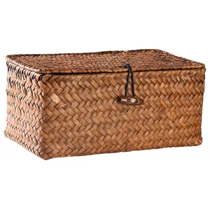 Handwoven straw storage box with lid and wooden toggle closure for desktop organization