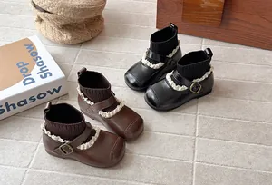Retro girls elastic sock boots in black and brown featuring ruffle detail and side buckle strap
