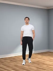 Men's black loose fleece sports sweatpants shown in a full-length lifestyle view