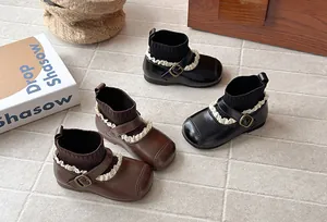 Vintage girls sock boots with lace trim and buckle detail in black and brown