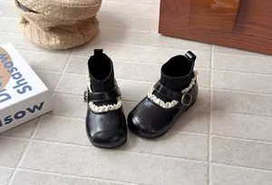 Vintage black girls' sock boots featuring elegant lace trim and cozy fly-knit ankle cuffs