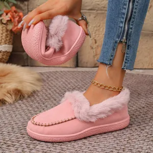 Warm pink suede slippers with fluffy faux fur lining and flexible flat sole