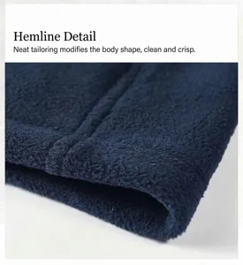 Close-up macro view of the clean-cut hem on a navy blue polar fleece jacket detail