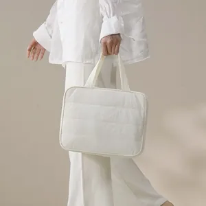 Large capacity white quilted toiletry bag for travel, minimalist handheld organizer