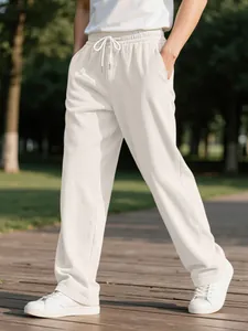 Detailed view of men's cream corduroy casual trousers with a comfortable drawstring waist
