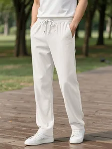 Detail of off-white men's corduroy casual pants with elastic drawstring waist design