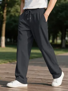 Detailed shot of men's charcoal corduroy casual pants with adjustable drawstring waist