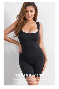 Detail showing the sculpting fit of a black high-stretch tummy control shapewear bodysuit.