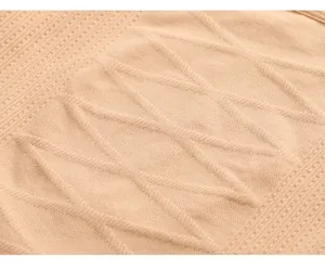Close-up of breathable beige knit fabric with diamond pattern for shaping bodysuit