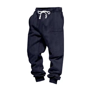 Detail view of men's navy blue heavy jacquard cable-knit texture jogger sweatpants