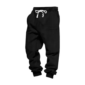 Detailed view of men's heavy jacquard joggers in black with white drawstring waist