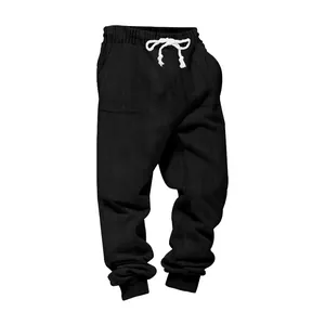 Close-up of black heavyweight jacquard joggers with white drawstrings and cuffed ankles