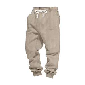 Detail of men's heavyweight jacquard knit joggers showing fabric texture and white drawstring waist.