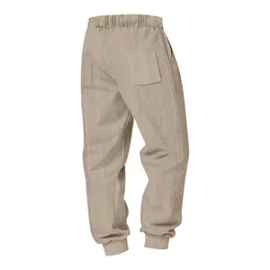 Back view of men's beige cable-knit joggers showing jacquard texture and pocket detail.
