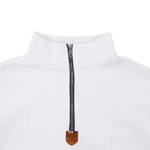 Close-up of white heavyweight fleece sweatshirt featuring half-zip stand collar