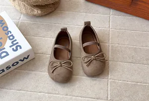 Elegant brown suede girls Mary Jane shoes featuring a charming bow detail and elastic strap