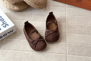 Top view of brown suede girls' princess shoes with delicate bow detail and soft soles