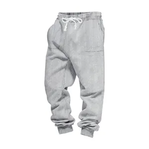 Detail view of men's grey American heavy jacquard joggers featuring drawstring waist