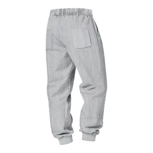 Detailed view of light gray cable knit joggers with ribbed cuffs and back pockets