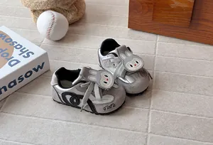 Detailed view of kids cartoon rabbit sneakers with stylish silver and gray suede finish