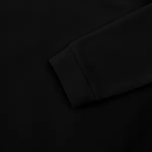 Detailed macro view of the ribbed sleeve cuff on a heavy black fleece sweatshirt