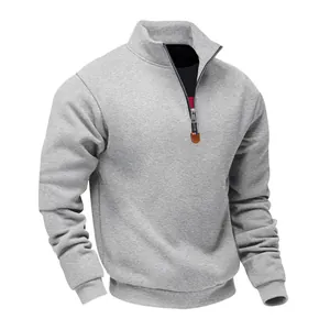 Detailed view of grey heavyweight fleece sweatshirt with stand collar and 1/4 zip