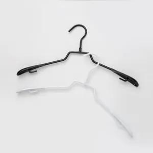 Set of black and white non-marking clothes hangers with non-slip shoulder support design.