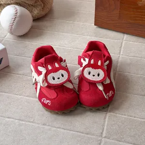 Red children sneakers with cartoon bunny design and soft rubber soles for boys and girls