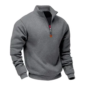 Detailed view of men's dark gray quarter-zip fleece sweatshirt with cozy stand collar