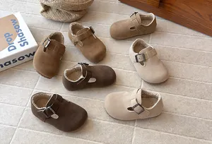 Detail view of children's vintage Birkenstock-style fleece-lined loafers in various colors