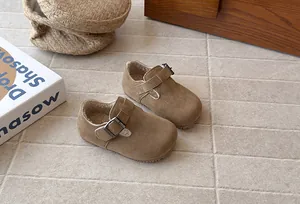 Retro brown children's Birkenstock style shoes featuring cozy warm fleece lining