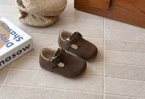 Detail view of vintage brown kids' winter shoes with cozy faux shearling lining.