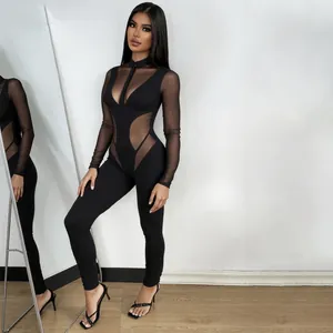 Mono sexy negro de manga larga con retazos de malla transparente y aberturas chic