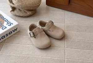 Close-up of warm fleece lining and suede texture in beige toddler Birkenstock style shoes
