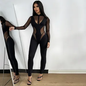 Mono negro sexy con retazos de malla y diseño hueco de manga larga