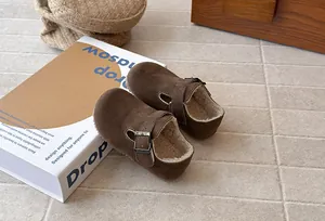Warm brown suede children's clogs with soft fleece lining and adjustable buckle strap
