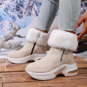 Stylish women's warm beige snow boots with white faux fur collar and platform soles
