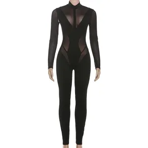 Mono negro sexy para mujer con retazos de malla transparente y cuello alto